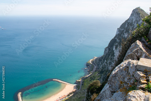 Gibraltar rock nature reserve, coastal view with blue strait waters at a secluded beach