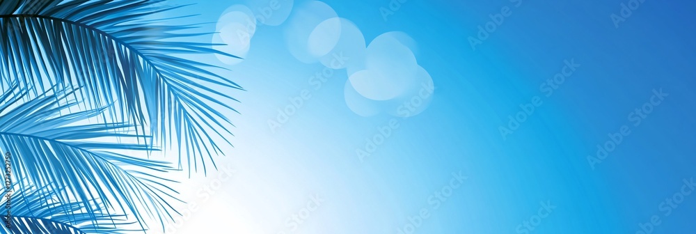 Sunny tropical palm leaves against a bright blue sky. Sunny tropical palm leaves against a bright blue sky.