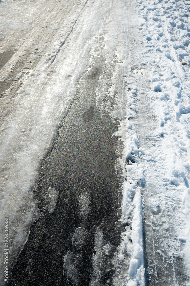 Road markings with separate lanes for pedestrians and bicycles. Winter conditions.