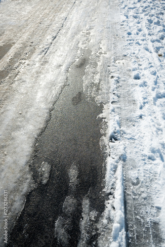 Road markings with separate lanes for pedestrians and bicycles. Winter conditions.
