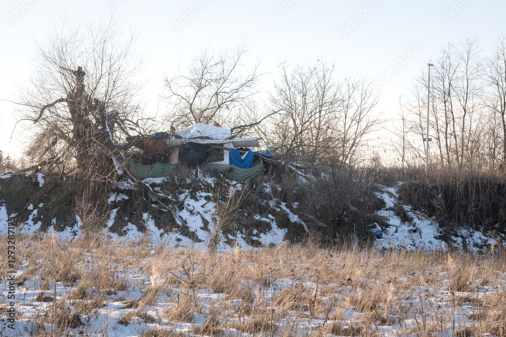 A camp of homeless people, hardships of life in winter.