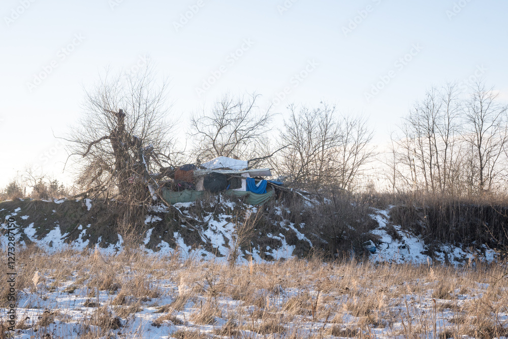 A camp of homeless people, hardships of life in winter.