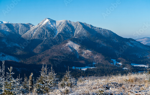 A view of the upper levels of the mountains covered in frost on a beautiful frosty day. photo