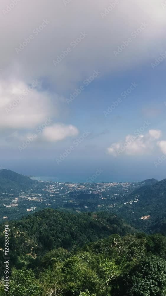 Timelapse view of the mountains of a tropical island and the ocean Timelapse view of the mountains of a tropical island and the ocean
