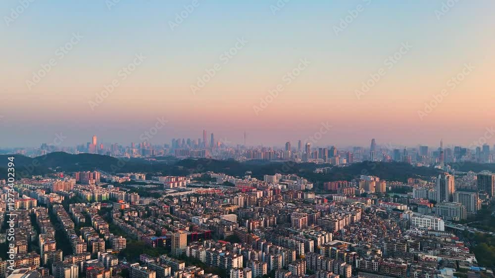 Establishing drone shot of Guangzhou City cityscape and skyline at sunset in Guangdong, China Establishing drone shot of Guangzhou City cityscape and skyline at sunset in Guangdong, China