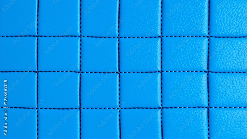 Fototapeta premium The surface texture of artificial leather is blue, the surface is stitched in the form of diamonds, squares, rectangles. Eco-leather in a kilt. 