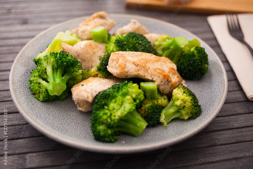 Chicken breast with broccoli on plate for healthy breakfast Chicken breast with broccoli on plate for healthy breakfast