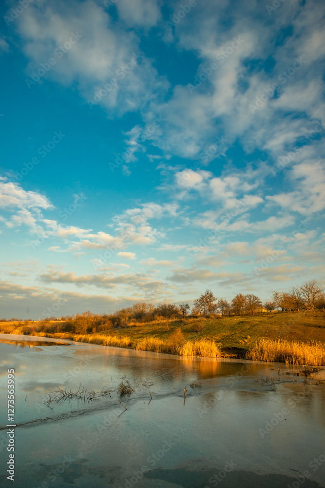 Fototapeta premium Beautiful nature on the lake ,sunrise from the hills, landscape photoshoot of beautiful red and orange sunrise , sky and clouds , reflections on water . Breathtaking sunrise , place of silence 