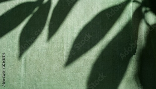 abstract botanical pattern sunlight shadow silhouette of leaves on linen sage green fabric aesthetic background for sustainable eco business brand