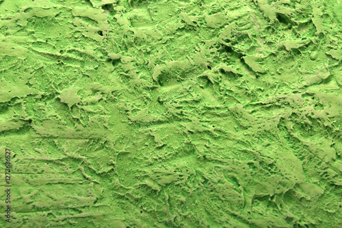 
plaster background in green color with fine texture