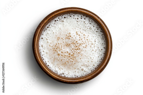 Frothy glass of Ayran in a classic ceramic cup on white background, traditional Turkish beverage photo