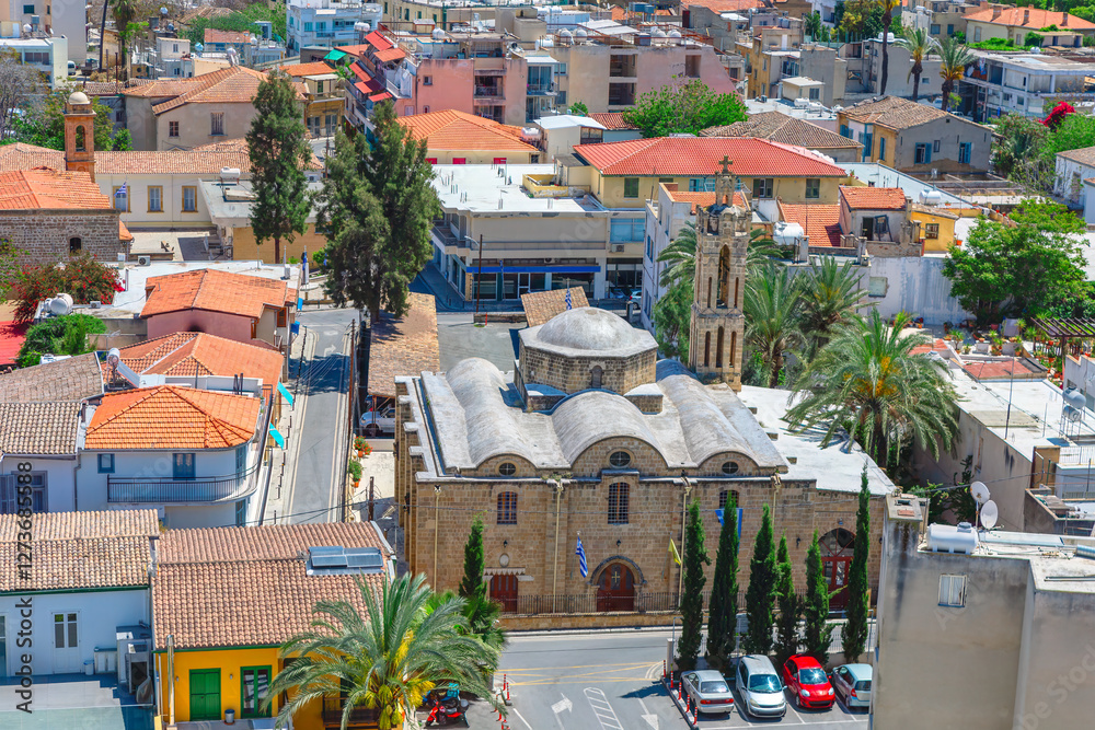Archangel Michael Trypiotis Church Greek Orthodox church in the old town of Nicosia, Cyprus. Surrounding area with various buildings providing a picturesque and detailed view of town architecture