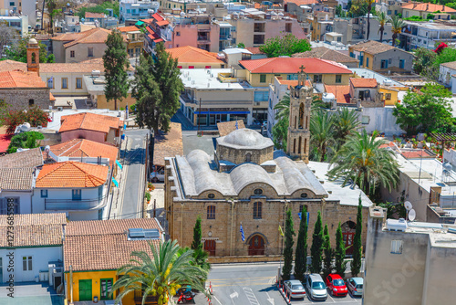 Obraz na płótnie Archangel Michael Trypiotis Church Greek Orthodox church in the old town of Nicosia, Cyprus. Surrounding area with various buildings providing a picturesque and detailed view of town architecture w salonie