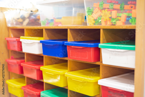 Foto Kindergarten classroom organization with wooden building blocks, plastic connect