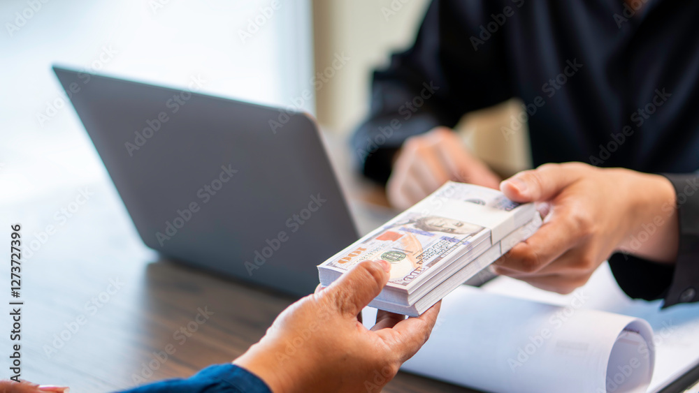 loan approval, and cash lending, a banker approval to person individuals a stack of US dollar bills in, business financing, and financial agreements. investment, credit approval, and money lending.
