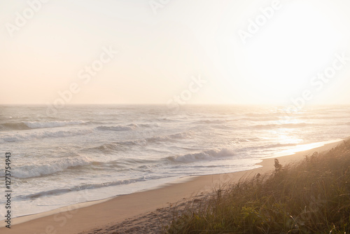 Sun setting over calm ocean and Cisco Beach photo