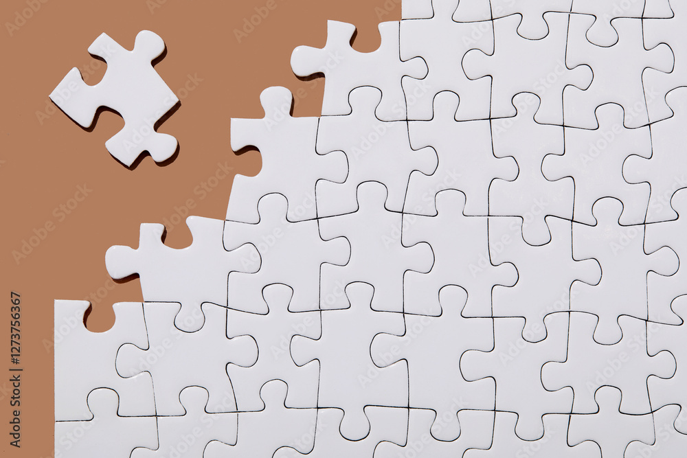 Studio shot of white jigsaw puzzle pieces Studio shot of white jigsaw puzzle pieces