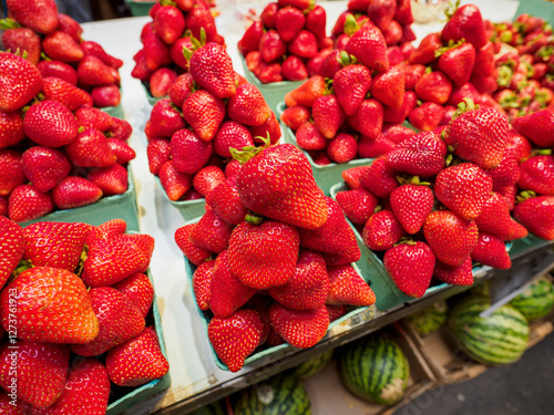 Close-up of ripe strawberries for sale on market stall photo