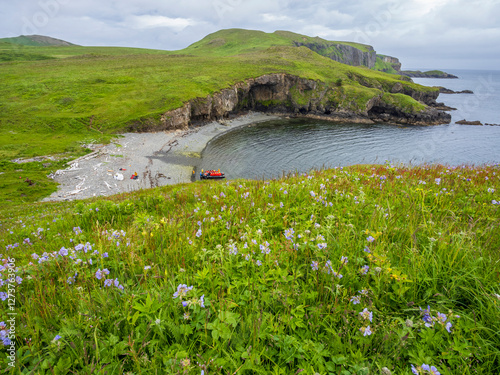 Tourists on raft at green coast photo