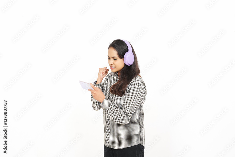 Playing game on smartphone with using headphones Of Beautiful Asian Woman Isolated On White Background Playing game on smartphone with using headphones Of Beautiful Asian Woman Isolated On White Background