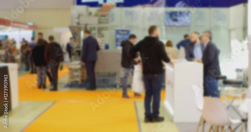 Anonymous crowd walking in a blurred convention center
