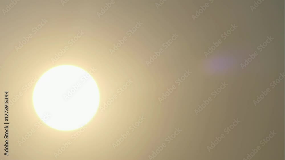 Golden hazy defocused sunset time lapse. Setting from top left to bottom left of frame. Golden hazy defocused sunset time lapse. Setting from top left to bottom left of frame.