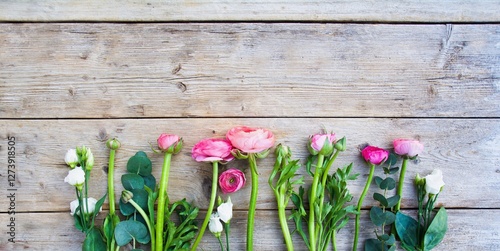 spring flowers on wooden ba...