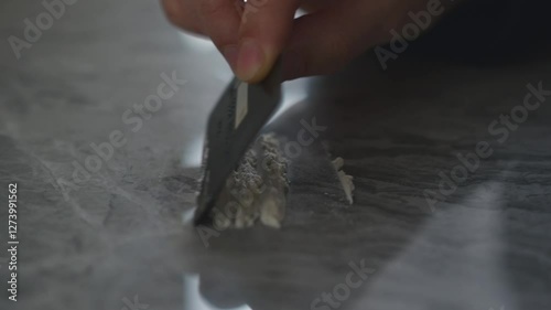 Drugs on the table close-up.
A drug addict is about to snort drugs.
Credit card and drugs on the table.
Drug trafficking theme.
Using narcotic powder