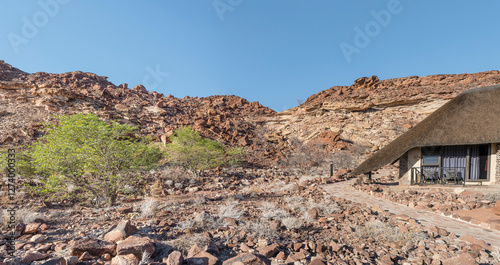 Obraz na płótnie rocks on slope of sandstone hills, at lodge near Twyfelfontein, Namibia w salonie