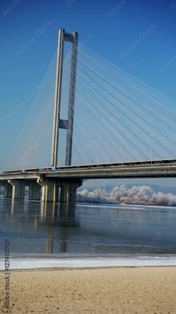 View of the bridge over the river in winter on a sunny day.
Bridge over the river on a winter morning.
Frozen river and transport bridge.
Frozen lake during the day in very cold weather View of the bridge over the river in winter on a sunny day.
Bridge over the river on a winter morning.
Frozen river and transport bridge.
Frozen lake during the day in very cold weather