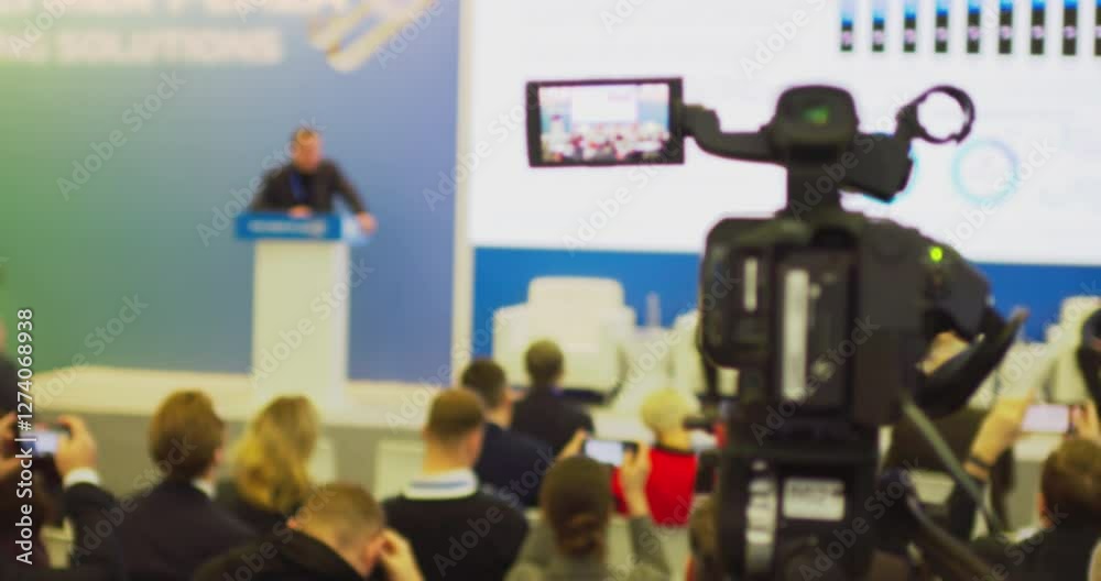 Blurry event video capturing speaker and audience interaction