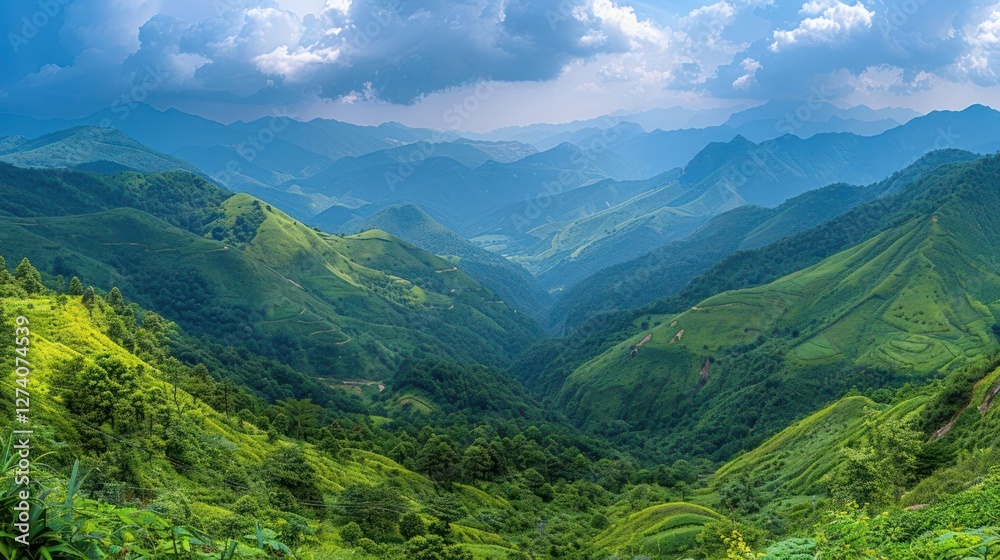 Fototapeta premium Lush green mountains under a cloudy sky, showcasing natural beauty and serene landscapes.