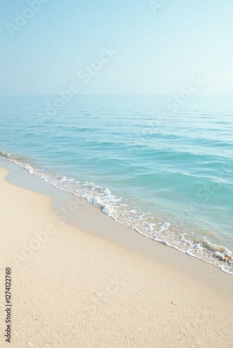 Serene Coastal Scene Gentle Waves Caressing a Pristine Sandy Shore Under a Calm Azure Sky