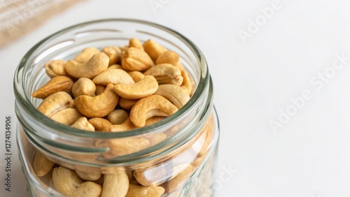 Cashews in Glass Jar on White Background