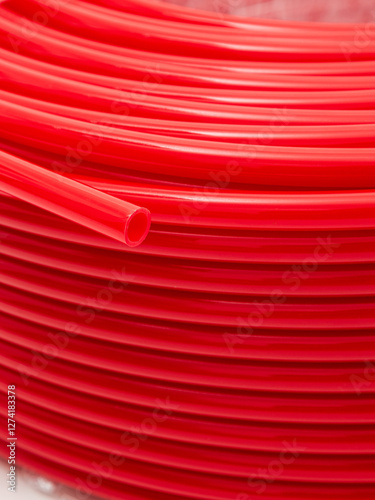 Red irrigation hose close-up. Background.