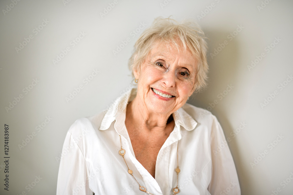 Beautiful senior woman in front of a white background Beautiful senior woman in front of a white background