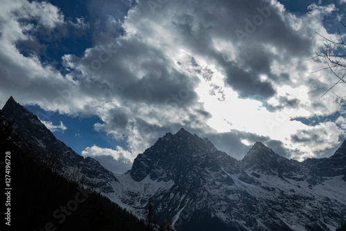 Majestic mountain peaks under dramatic clouds alpine region nature photography outdoor adventure scenic view natural beauty