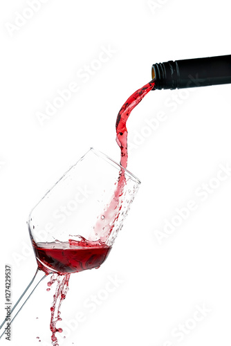 Pouring red wine into a glass, frozen motion on white background