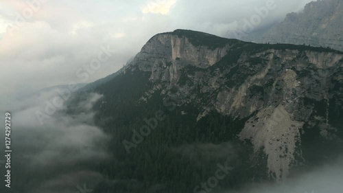 Aerial panoramic view of Dolomites Alps with impressive clouds in Italy