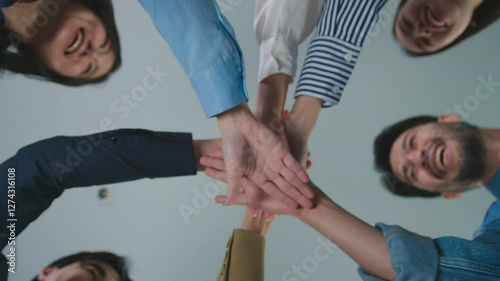 Teamwork collaboration building trust gathers around a table, joining hands to teamwork with documents charts business analysis. unity concept partnership strategy goals motivation company growth