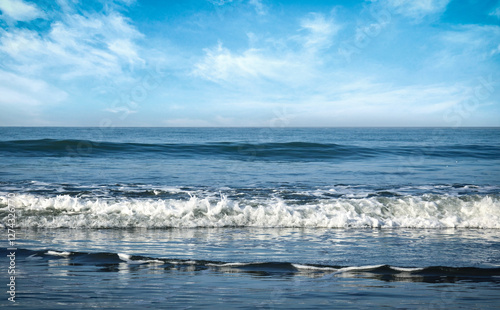 Beautiful sea ​​wave with foam. Cox's Bazar Sea wave during daylight with white clouds at the sky. Waves in the ocean