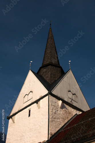 Historic Church Spire Against Blue Sky,
