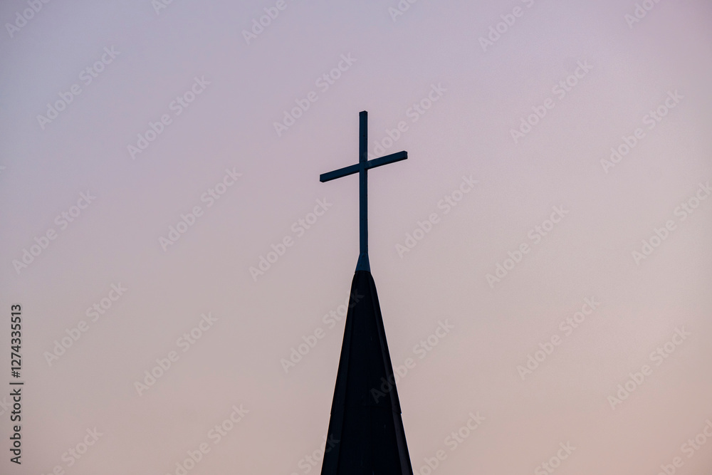 Catholic cross against the bright sunset sky. Beautiful sky background with a cross. Christmas, Easter Catholic cross against the bright sunset sky. Beautiful sky background with a cross. Christmas, Easter