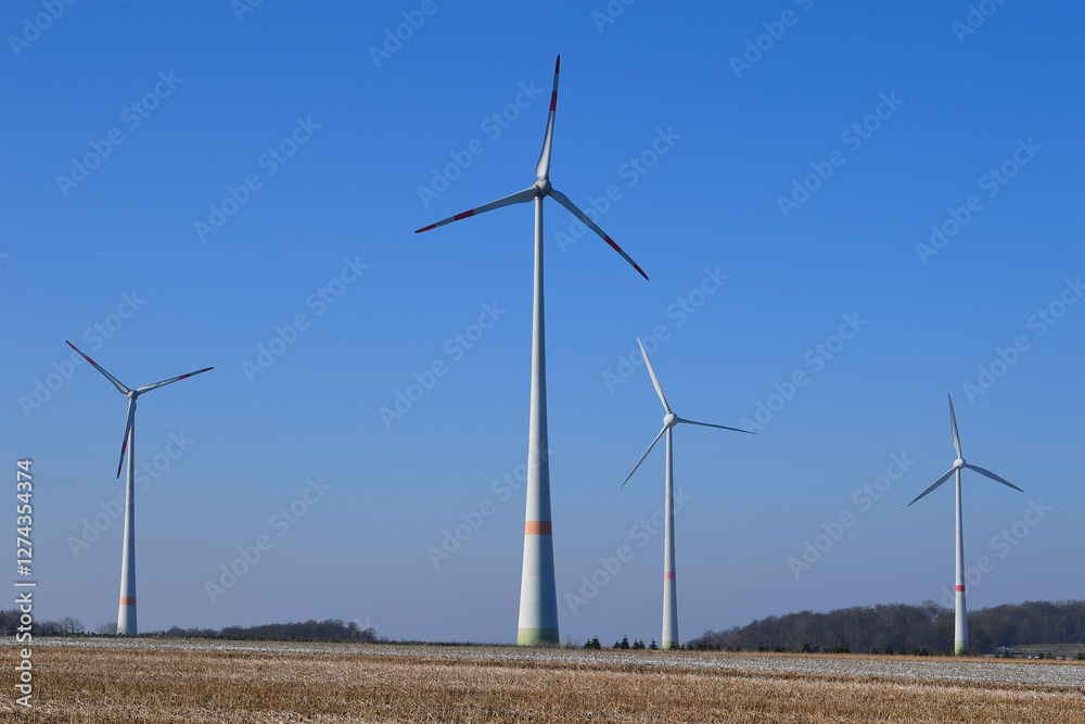 Wind farm with wind turbines or wind mills provide renewable electricity, blue sky Wind farm with wind turbines or wind mills provide renewable electricity, blue sky