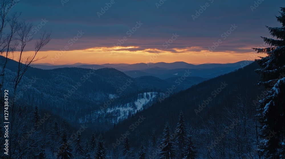 Obraz premium Winter Sunset Over Snowy Mountain Ranges