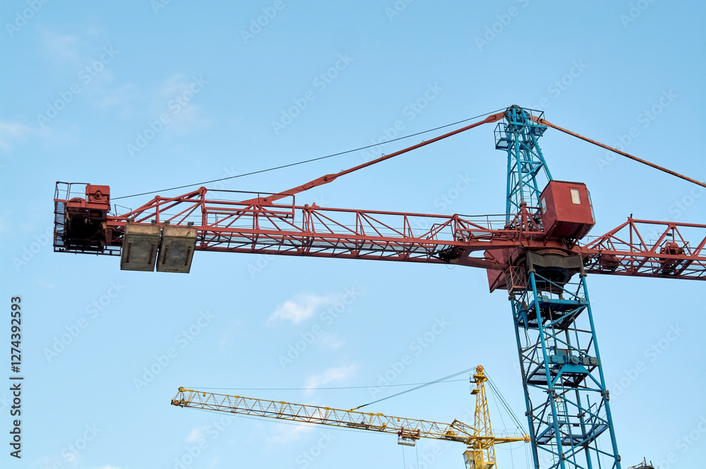 construction site and a big crane on the background blue sky construction site and a big crane on the background blue sky