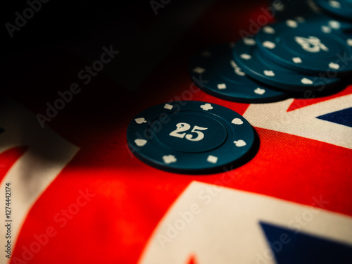 Gambling Poker chip on British Union Jack flag close up selective focus