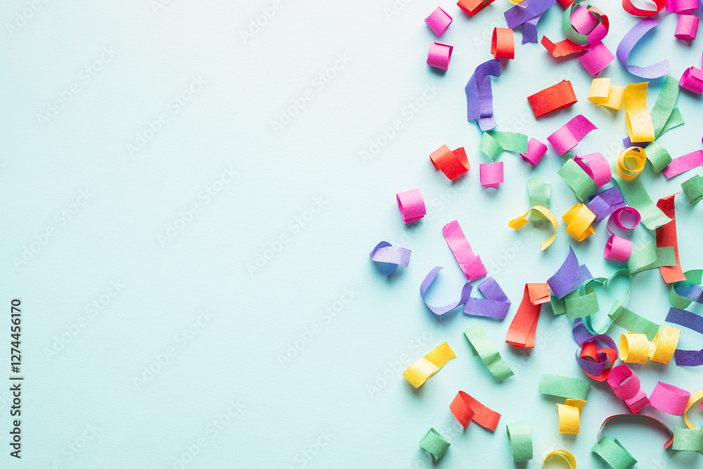 Banner with colorful paper confetti on blue background with copy space. Birthday party. Banner with colorful paper confetti on blue background with copy space. Birthday party.
