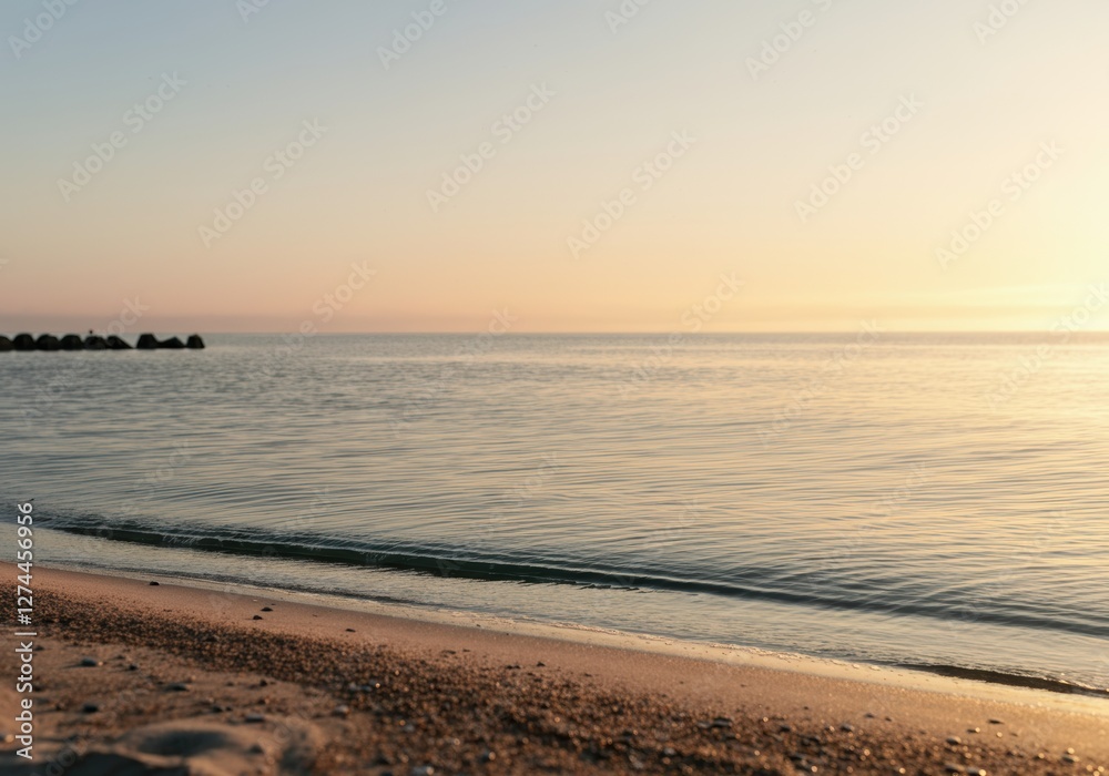 Serene beach at sunset with calm waves lapping the shore Serene beach at sunset with calm waves lapping the shore