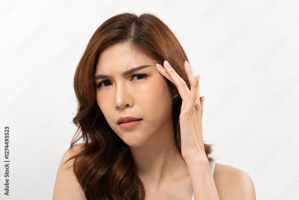 Asian woman concern in skincare with wavy hair against a plain white background Asian woman concern in skincare with wavy hair against a plain white background